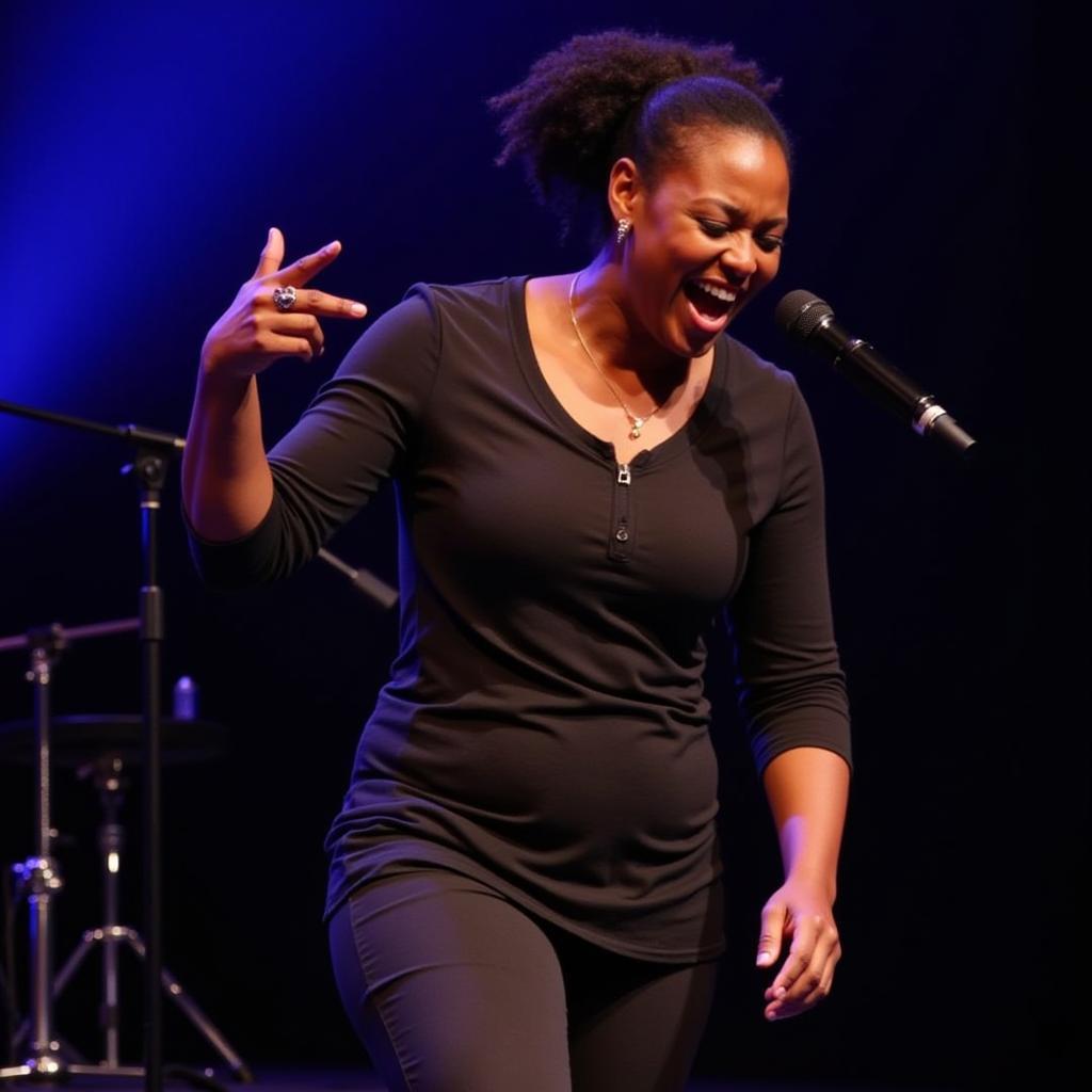 Catherine Kusasira Live Performance: A captivating image of the artist performing on stage, engaging with the audience and showcasing her stage presence.